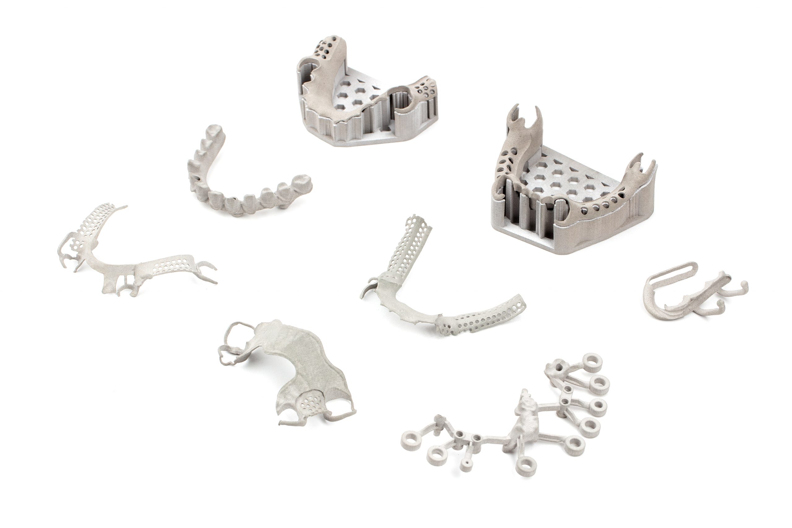 Dental applications 3D printed in chrome cobalt on Shop System. Photo via Desktop Health.