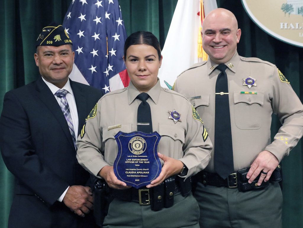 Apolinar receiving the Law Enforcement Officer of the Year for Valor award for her bravery during the attack.