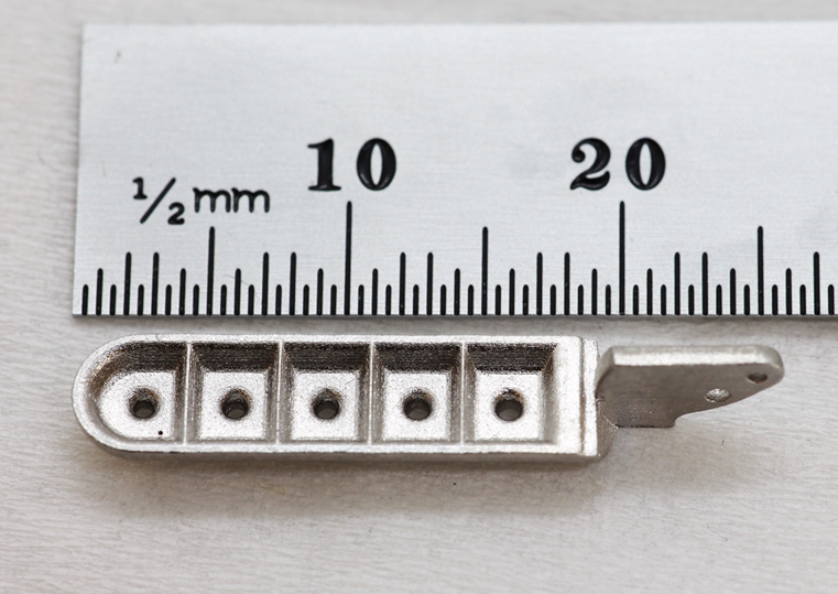 3D printed medical biopsy shovel with sharp 20 µm segments.  Photo via Holo.