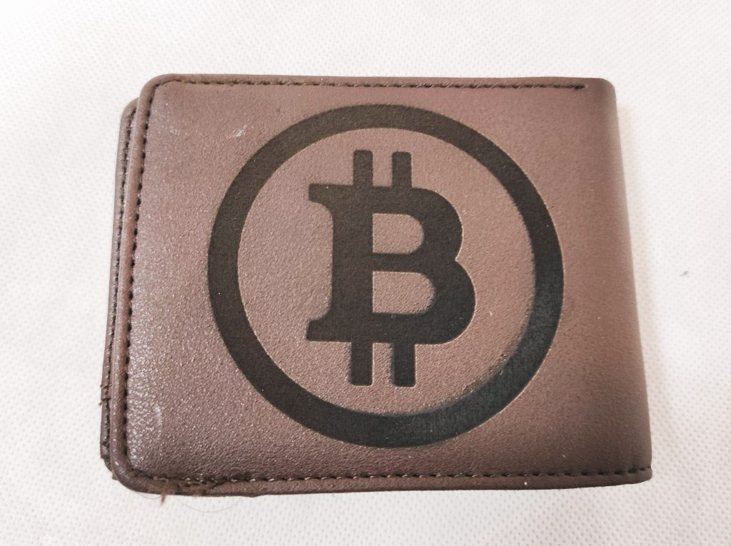 A leather wallet engraved with a Bitcoin symbol made by George Formitchev. Photo via Endurance Lasers.