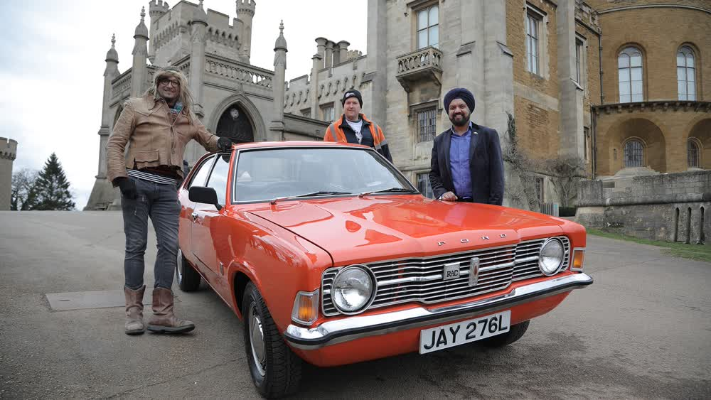 Car SOS TV hosts (left and center) and Bobby Singh, owner of the restored Ford Cortina Mark III after the grand reveal (right). Photo via Car SOS.