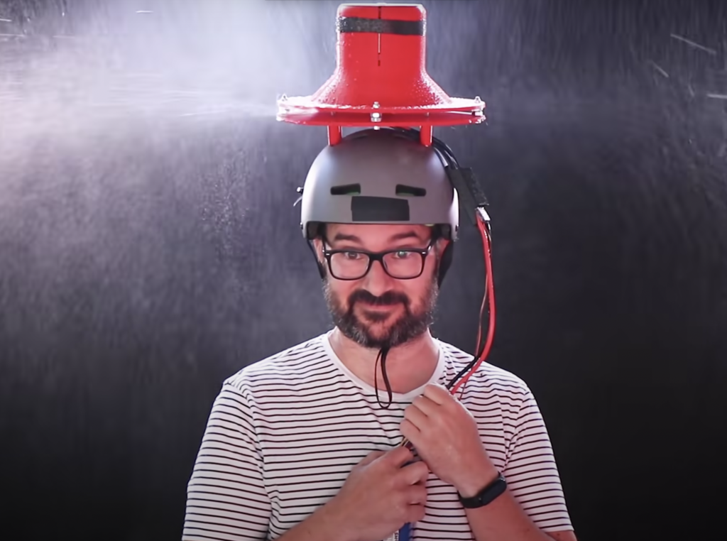 Youtuber Ivan Miranda testing the third version of his turbine umbrella hat. 