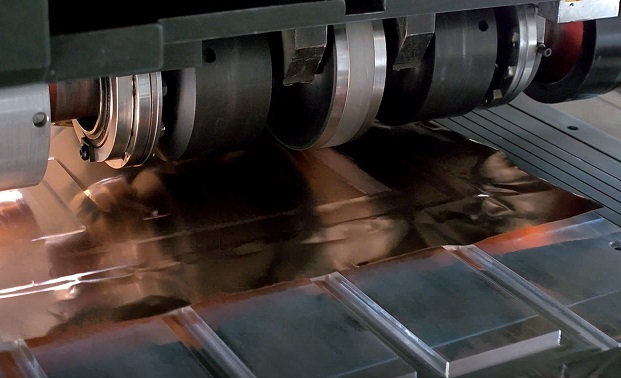 SonicLayer X̅ seam welding in action to produce copper foil onto copper busbar, small. Photo via Fabrisonic.