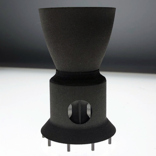 The non-eroding throat insert for a solid rocket motor nozzle 3D printed using tungsten-rhenium. Photo via 6K Additive.