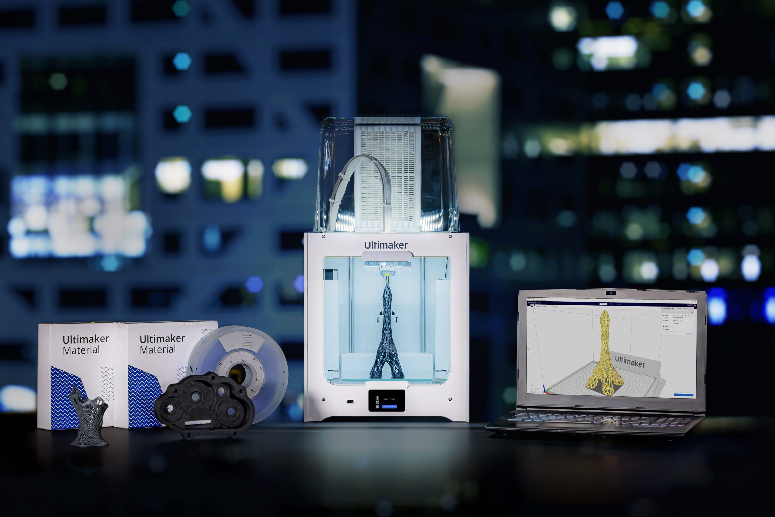 An Ultimaker 3D printer along with related materials and software.