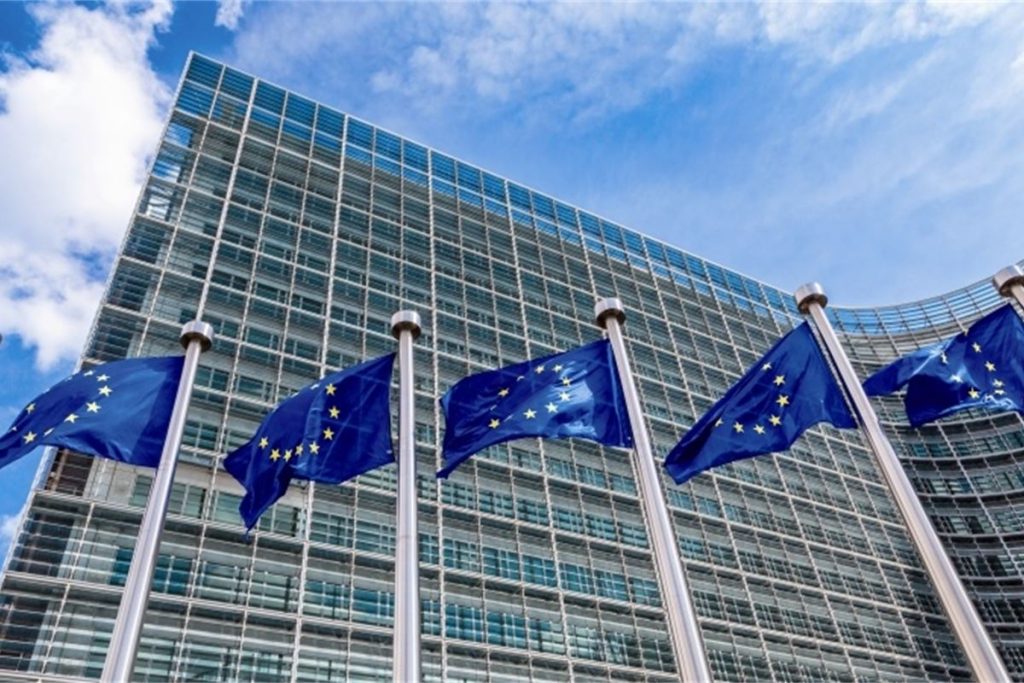 EU flags flying outside the European Commission.