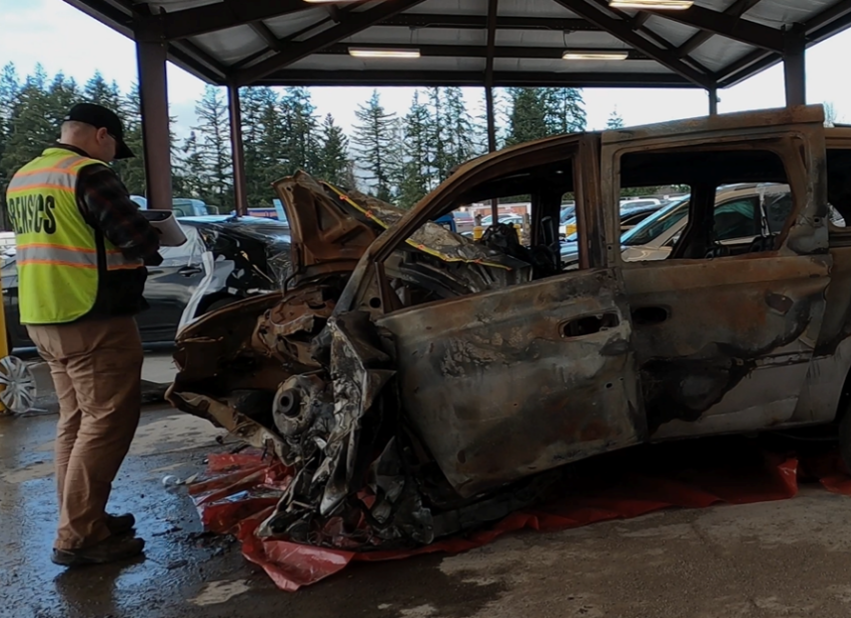 Origin Forensics' Jarrod Carter 3D scanning a crashed Dodge minivan. 
