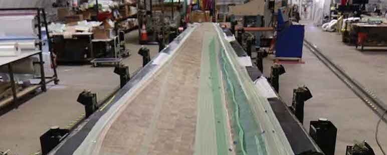 The NREL researcher's a 13-meter thermoplastic blade prototype.