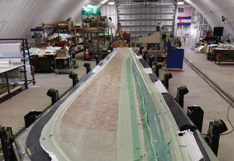 The NREL researcher's a 13-meter thermoplastic blade prototype.