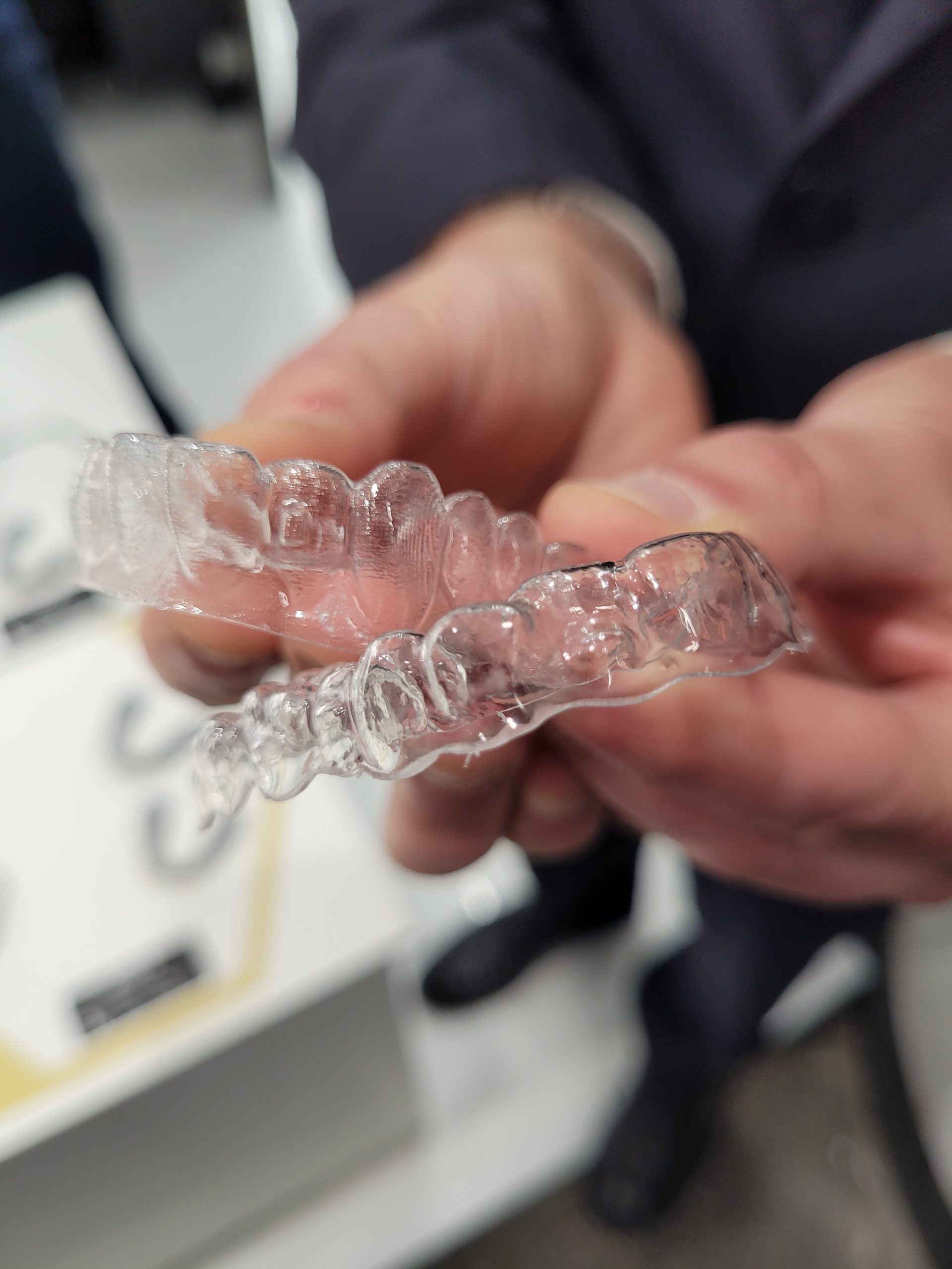 Comparing a HPS-printed dental aligner with a DLP-printed aligner. Photo via AXTRA3D.