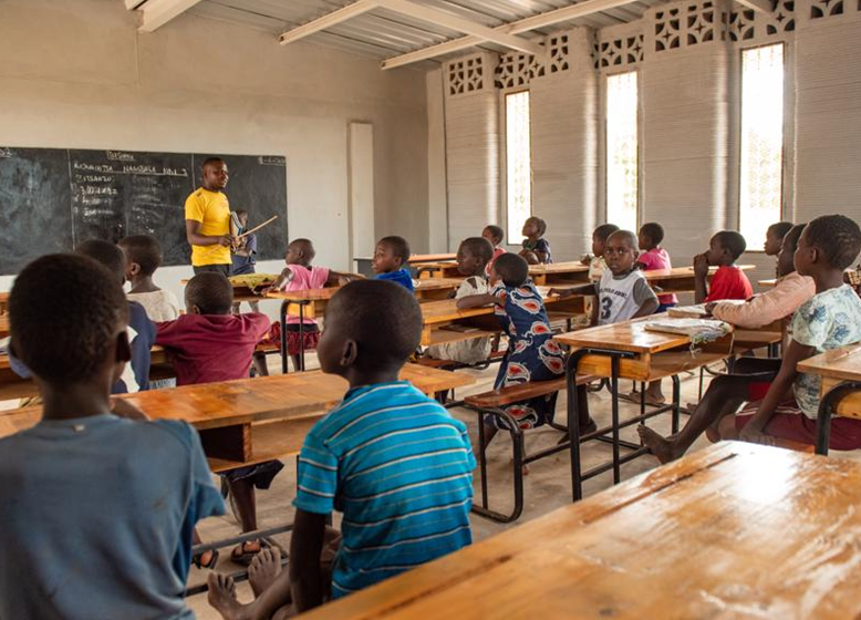 Malawian schoolchildren are taught at the world's first 3D printed school made by 14Trees with a COBOD BOD2 printer.  Photo by Bennie Khanyizira.