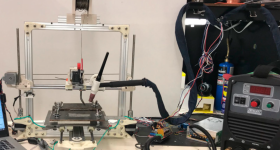 The researchers' prototype gantry-mounted WAAM 3D printer.