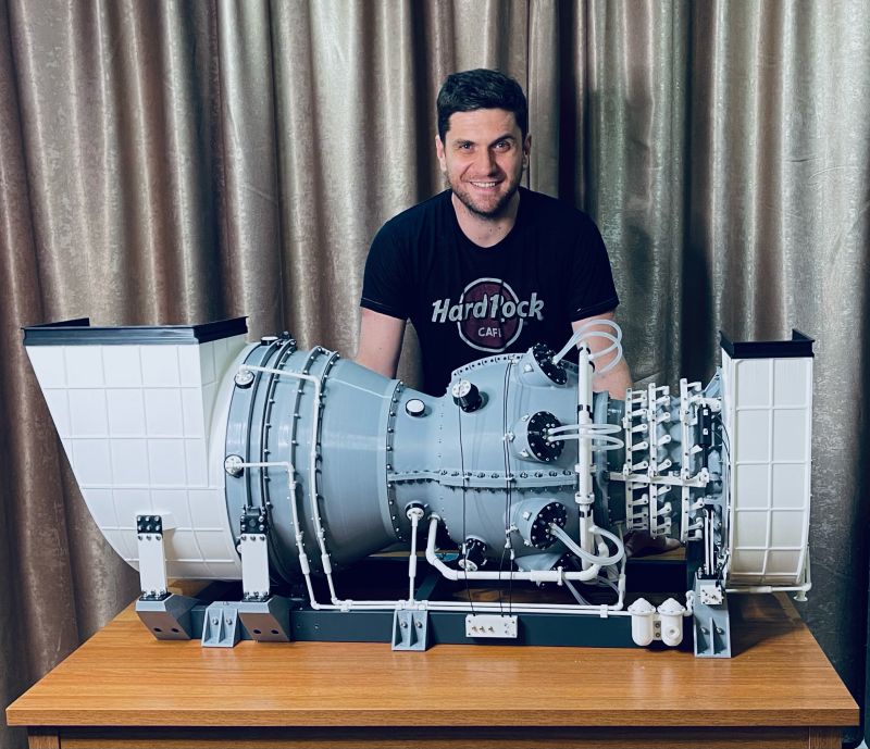 Engineer Ivan Korzhan and his 3D printed gas turbine engine model. 