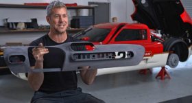 Ant Anstead shows a 3D printed part for the Lotus Type 62-2 coachbuilt as shown in the Discovery+ documentary, Radford Returns. Photo via Stratasys.