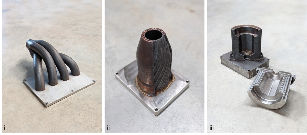 Example components manufactured by Meltio. i) Engine manifold, ii) combustion chamber, iii) glass mold core. Photos via Meltio.