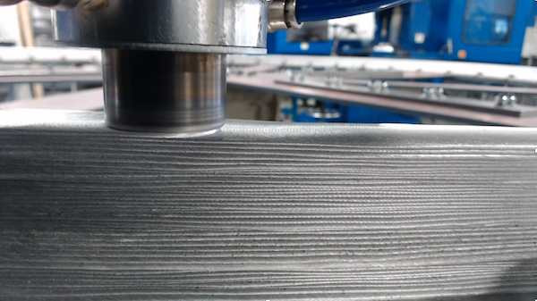 Additive Friction Stir Deposition in action. Photo via MELD Manufacturing.