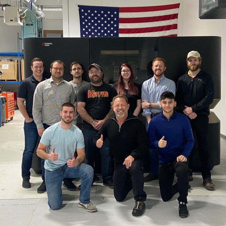 The Azoth team with their new XJet Carmel 1400M 3D printer. Photo via XJet.