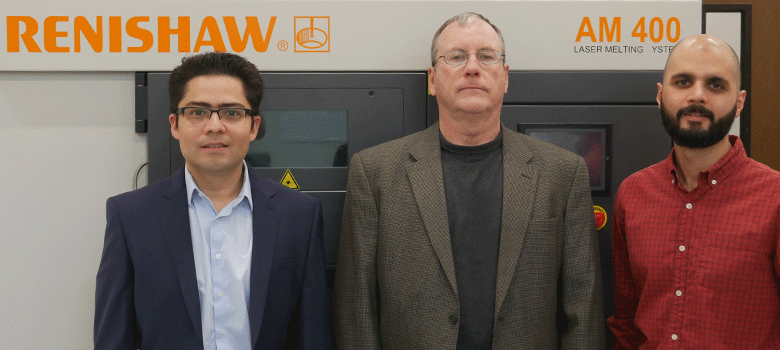 UTSA researchers Arturo Montoya, Harry Millwater and David Restrepo stand in front of the Renishaw 3D printer at the Makerspace in the Science and Engineering Building. Photo via UTSA.