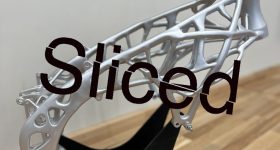 Nebrija University's 3D printed hollow tubular steel trellis motorcycle frame with the sliced logo.