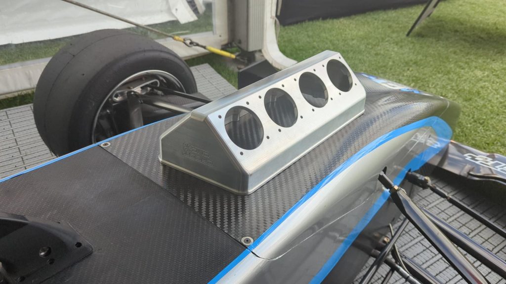 A 3D printed intake manifold atop an S500 race car. Photo via SPEE3D. 