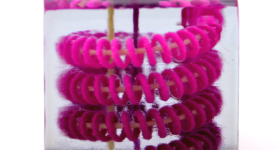 A liquid helical spiral 3D printed in a solid block. Photo via CU Boulder.