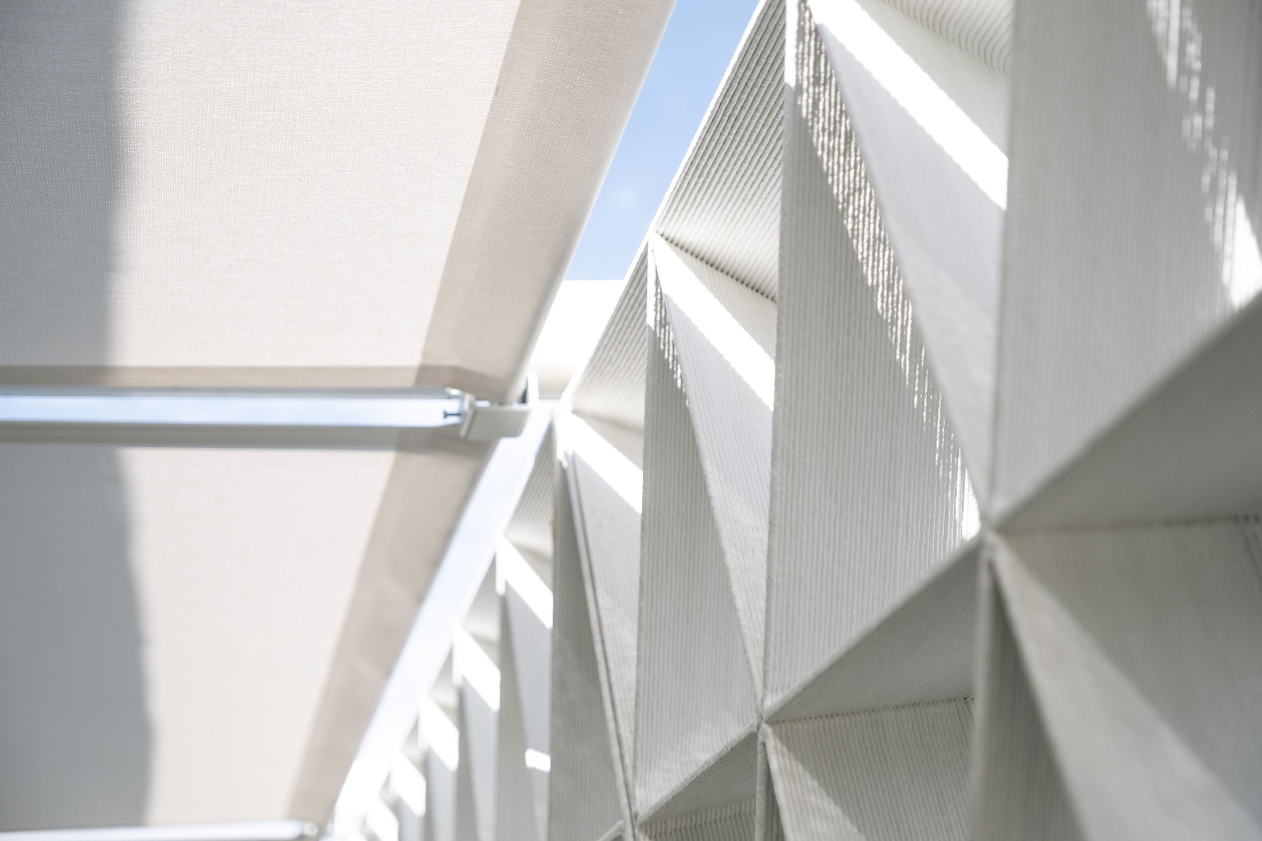 The claustra wall is made up of 3D printed triangles that slot together. Photo via Aectual.