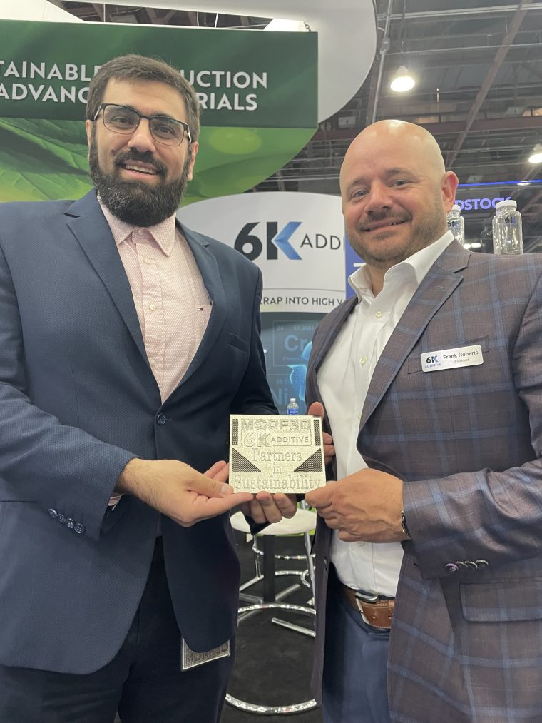 Dr Behrang Poorganji, VP of Materials Technology at Morf3D (L) and Frank Roberts, President of 6K Additive at the RAPID + TCT event in Detroit. Photo via 6K.