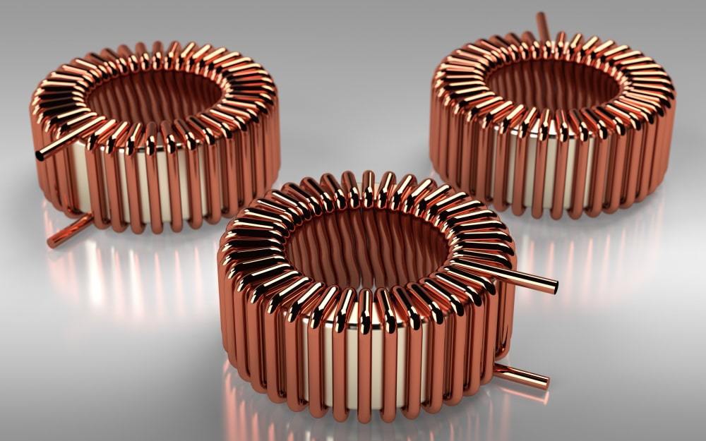 A ferrite inductor comprises a magnetic core surrounded by a copper coil. Image via Jurgis Mankauskas.