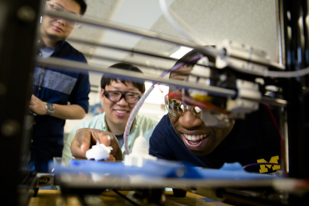 Chinedum Okwudire and students in his lab at the University of Michigan. Photo via Evan Dougherty.