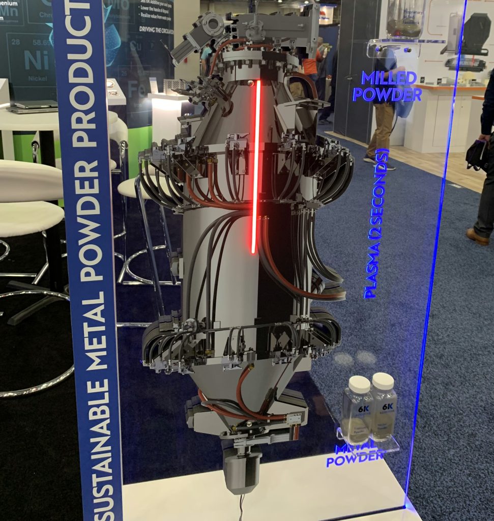 The display at 6K Additive's Rapid+TCT booth depicting its Unimelt technology. Photo by Paul Hanaphy. 