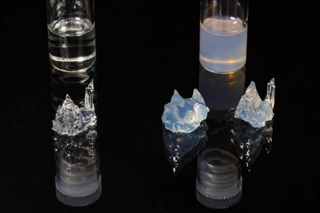 The same part 3D printed in transparent resin (left), opaque resin without correction (mid), and opaque resin with correction (right). Photo via EPFL.
