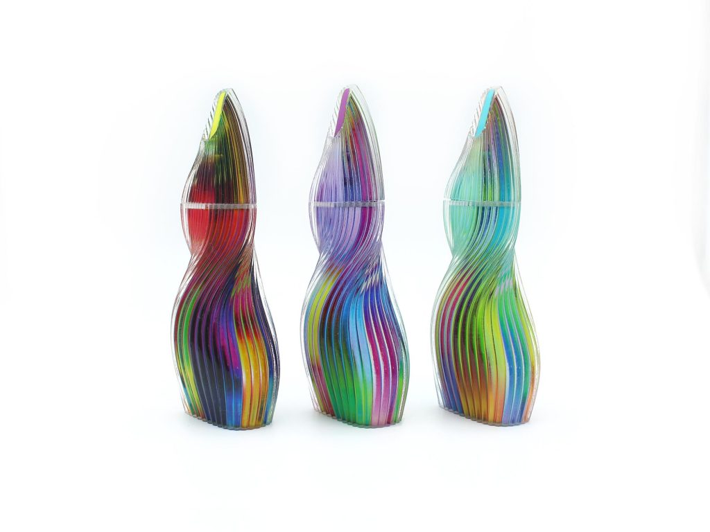 Perfume bottle with lenticular effect 3D printed by Illusory Material.  Photo via Stratasys.