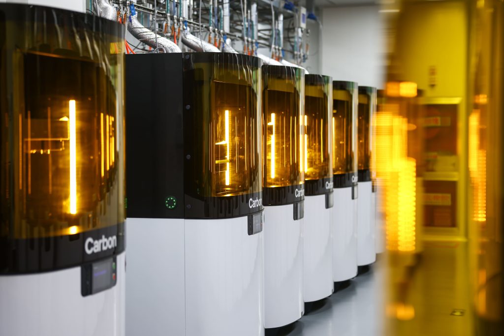 A fleet of Carbon 3D printers in an Oechsler factory.  Photo via Oechsler.