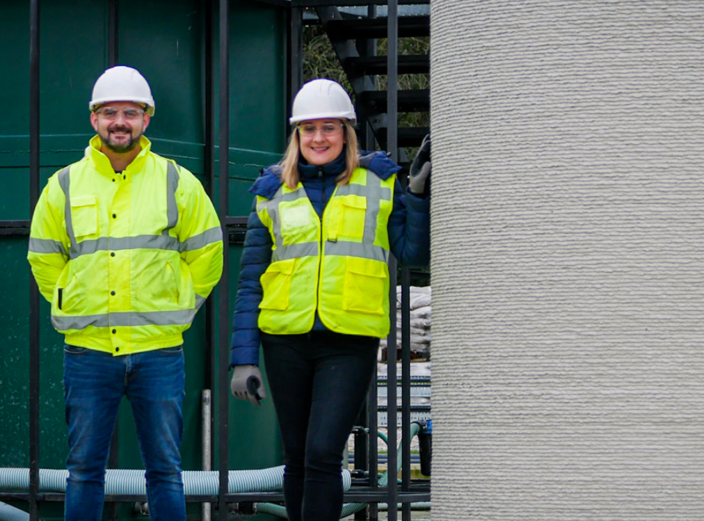 Changemaker 3D Co-founders Natalie and Luke Wadley with the UK's first 3D printed water chamber at the United Utilities site in Cheshire. Photo via Changemaker 3D. 