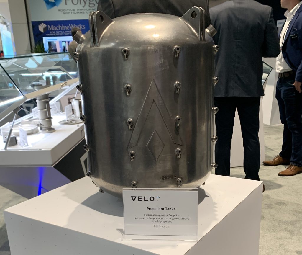 The 3D printed Launcher propellant tank at Velo3D's booth. Photo by Paul Hanaphy. 