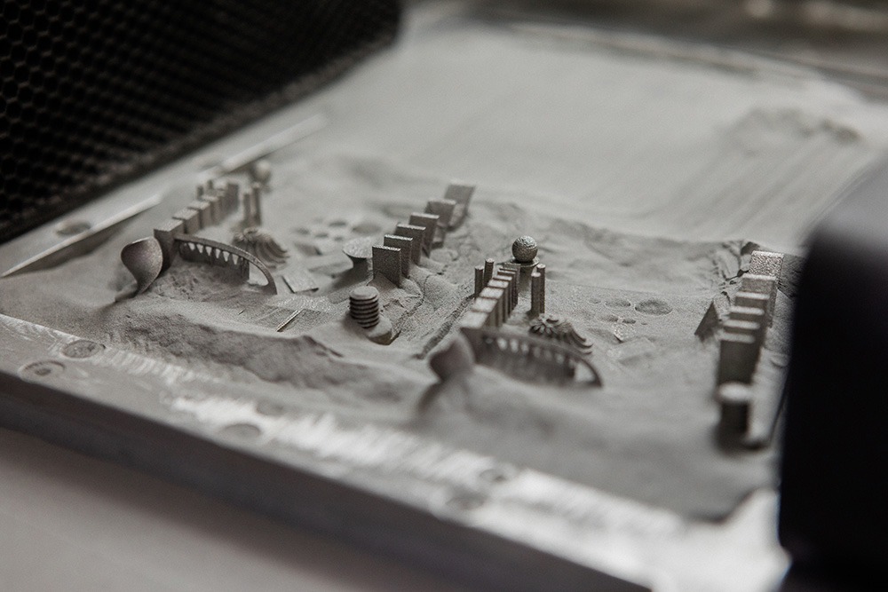 A print bed of Xact Metal-3D printed parts. Photo via Xact Metal. 