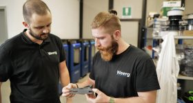 WEERG engineers assessing the quality of an INTAMSYS-3D printed part. Photo via INTAMSYS.