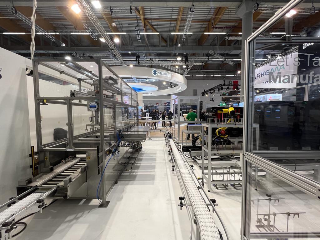 The conveyors connecting up Stratasys' demonstrator at Formnext. Photo by Mael Duportal.