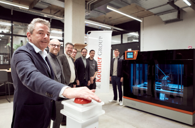 Kai Furler, CEO of the Koehler Group, symbolically presses the start button for the development of future ‐oriented prototypes on the BigRep PRO 3D printer in the MakerSpace. Image via Koehler Group.