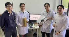 The NuSpace team with the final 3D printed satellite casing. Photo via Creatz3D.