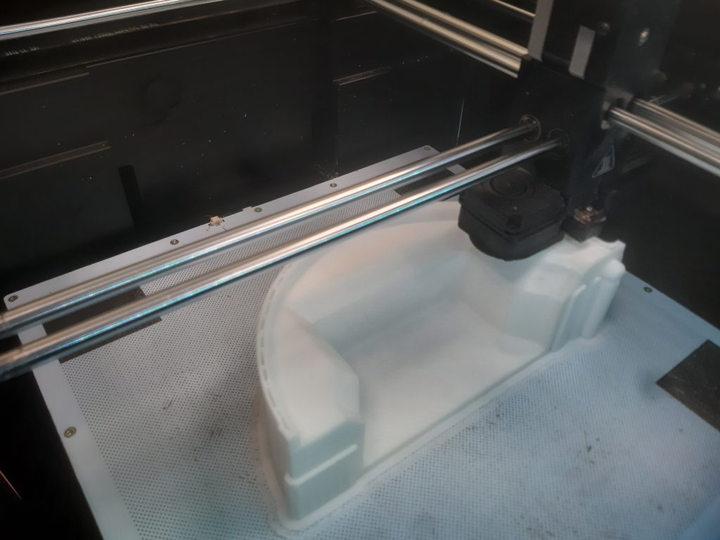 Part of a 3D printed engine cover on the Zortrax M300 Plus build platform. Photo via Zortrax. 