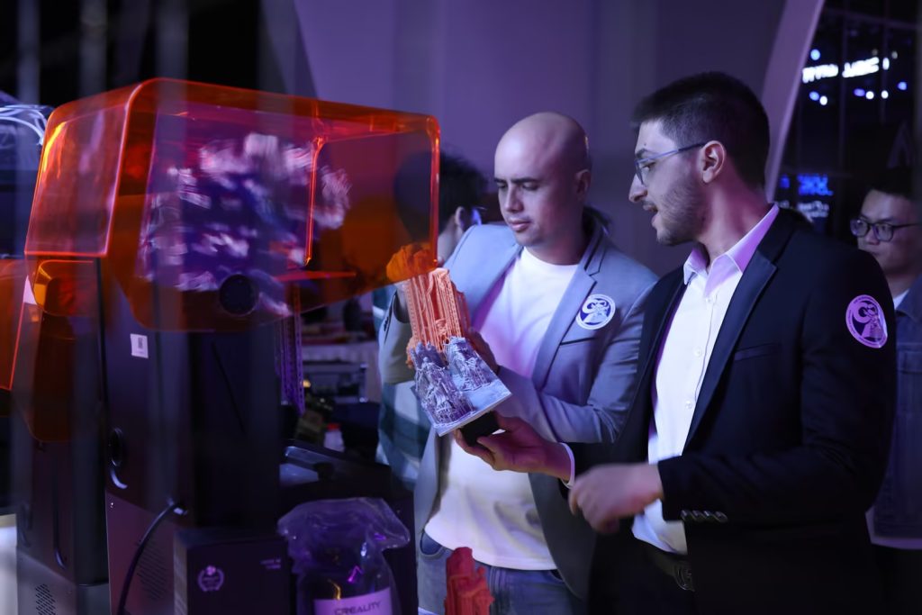 Demonstrating new Creality 3D printers during the anniversary and spring event. Photo via Creality