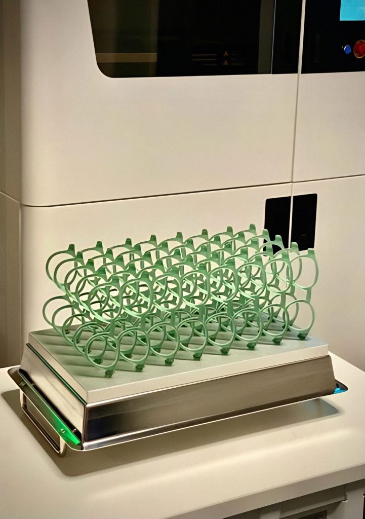 A production run of 3D printed eyeglass frames on a G2:F2 system using GENERA’s unique DLP technology. Photo via GENERA.