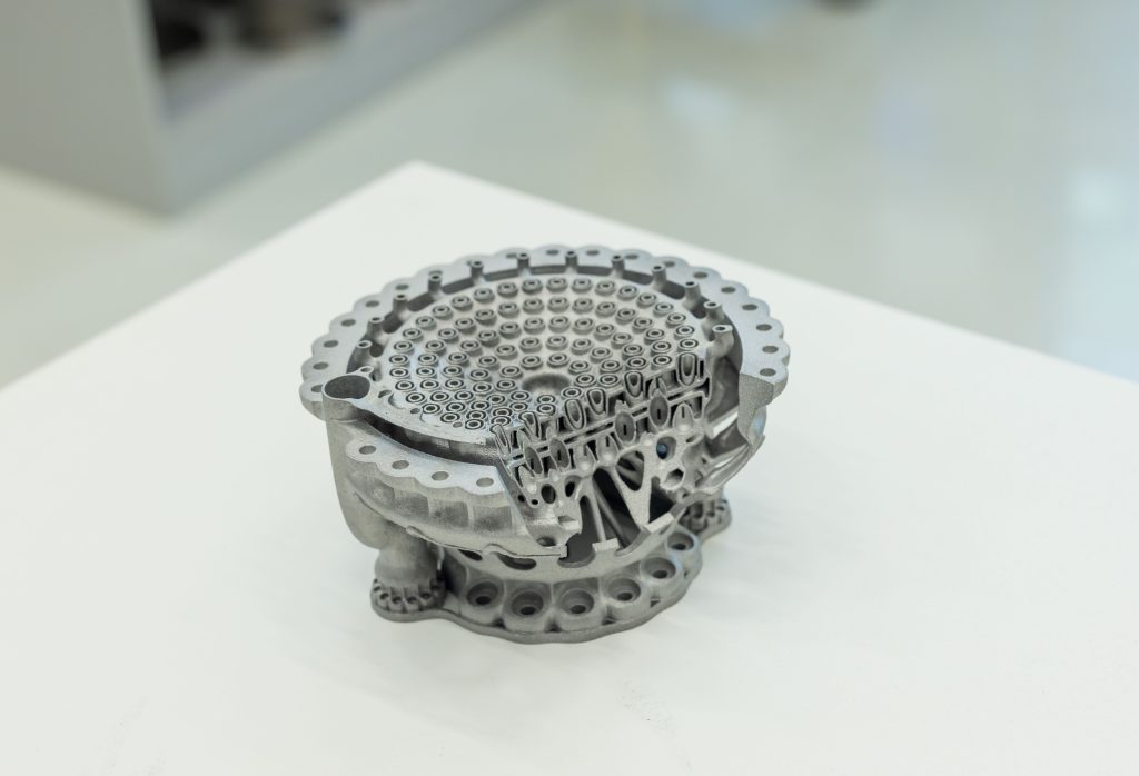 Metal 3D printed parts developed using AMALLOY. Photo via TII.