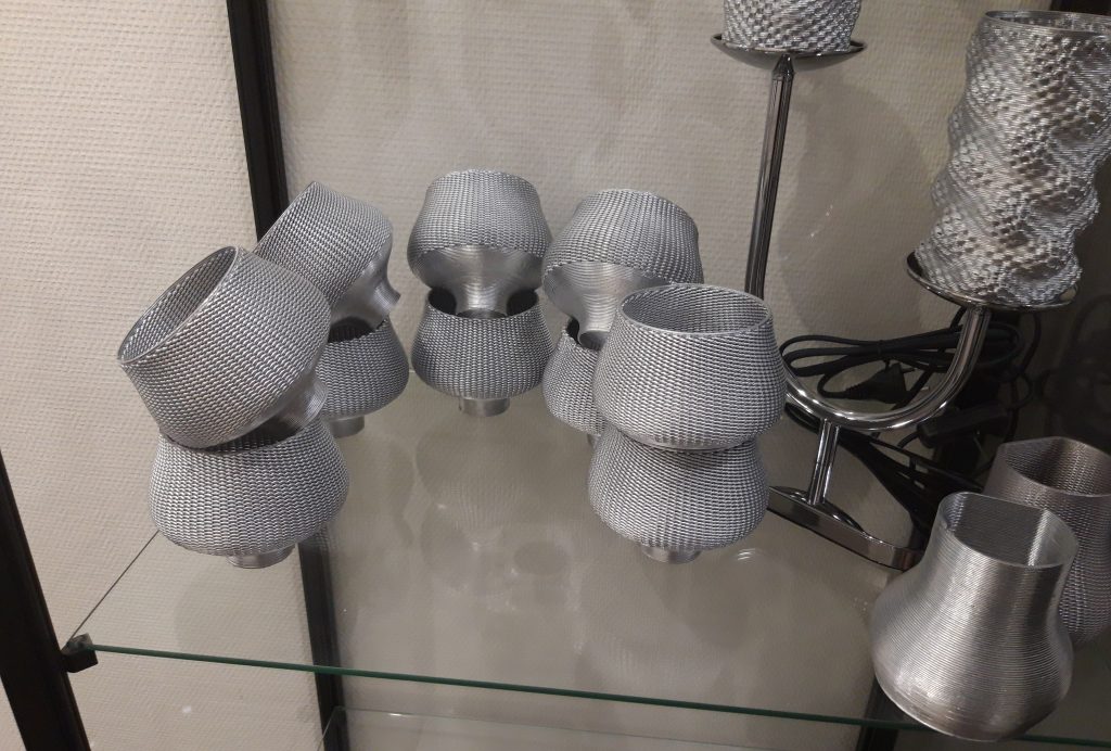 A series of lampshades 3D printed in metal. Photo via ValCUN.