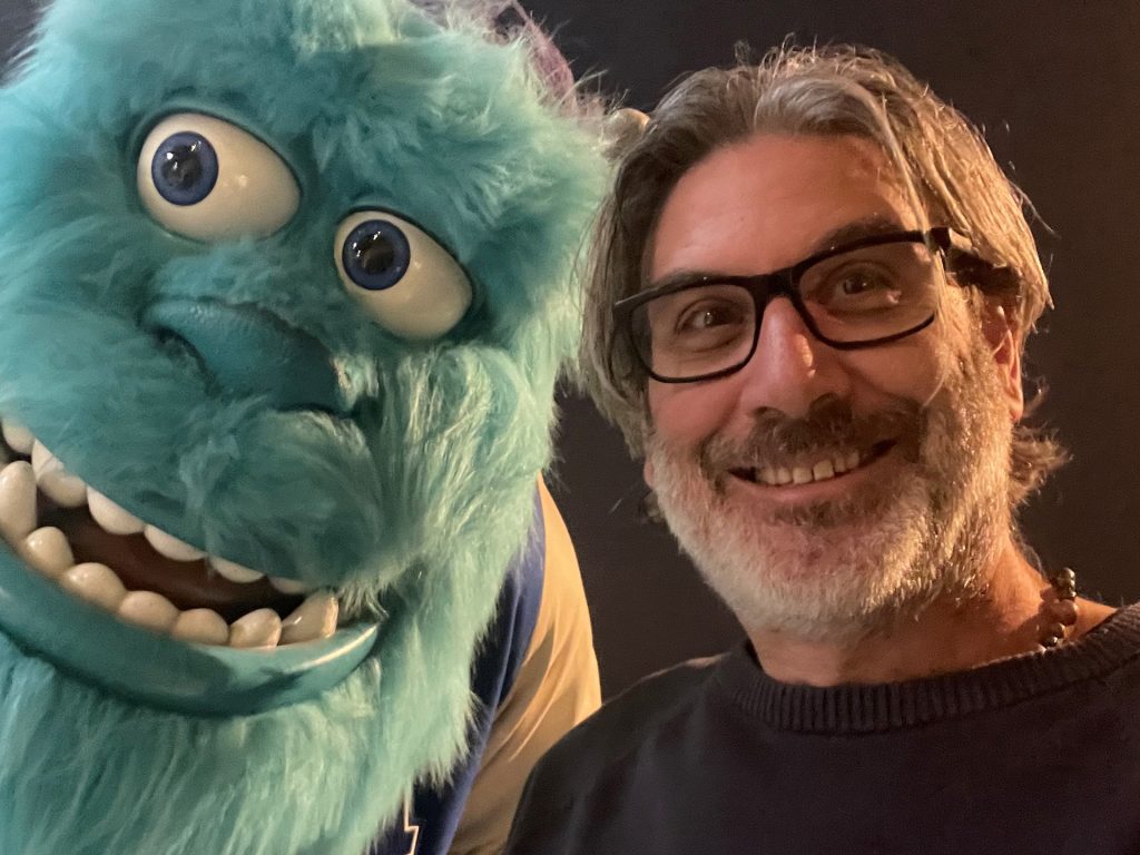 Jason Lopes, pictured with his friend Sulley, will return to the AMUG stage for his Tuesday keynote presentation. Photo via AMUG.