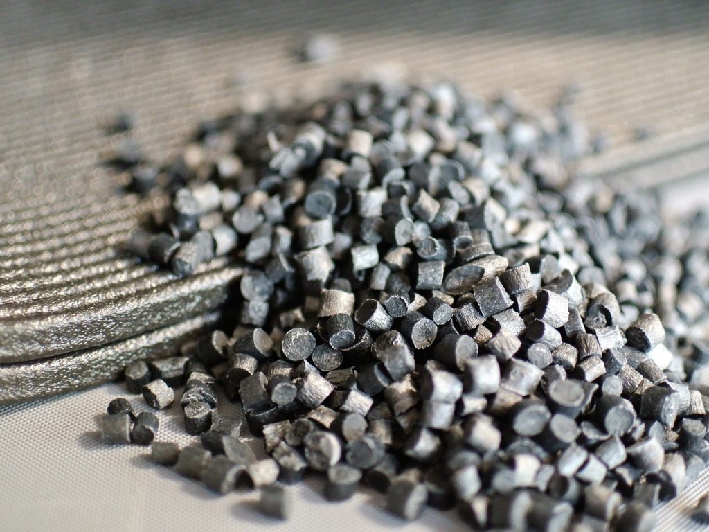 Pellet extrusion allows the use of high-performance engineering composite materials like these carbon fiber-filled ABS pellets at a cost up to 10x less than comparable filament. Photo via 3D Systems.