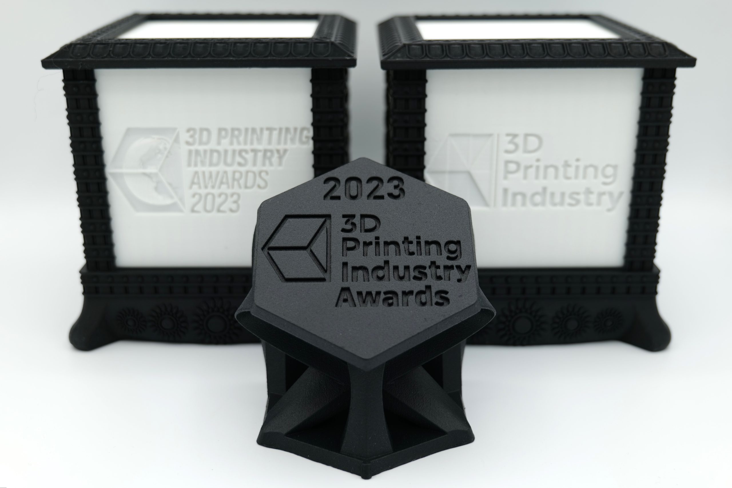 https://3dprintingindustry.com/wp-content/uploads/2023/12/Trophy-and-Litho-scaled.jpg
