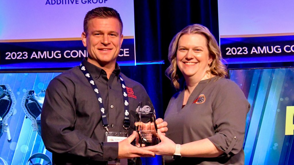 Bonnie Meyer presenting Ben Loerke, from University of Dayton Research Institute (UDRI) with the award for first place in Advanced Concepts in the 2023 Technical Competition. Photo via AMUG.