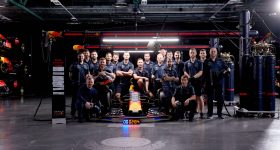 Crew poses for a photo during Red Bull Racing 2023 Pitch Black Pit Stop in Milton Keynes, England. Photo via Magenta Stills / Red Bull Content.